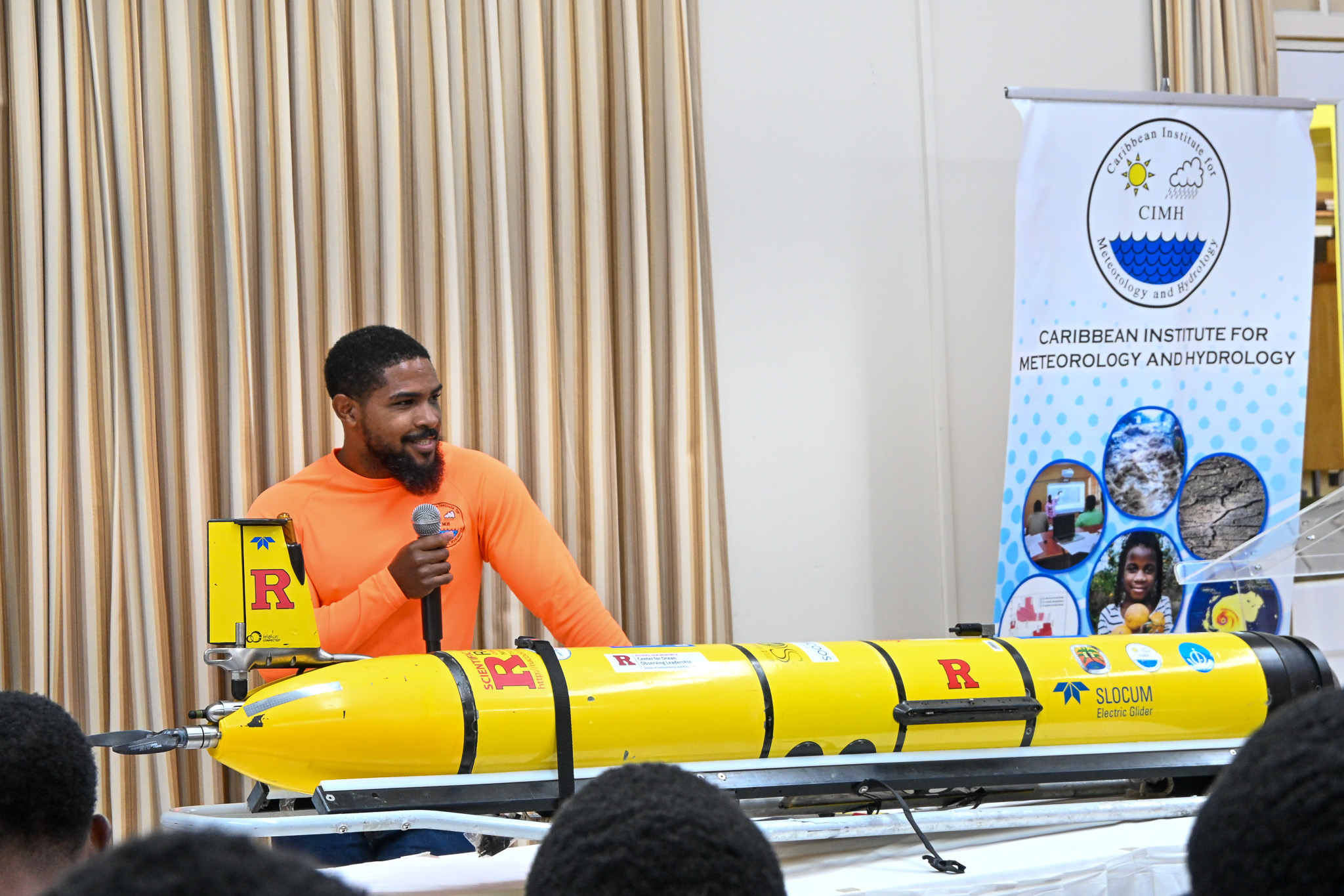 CIMH technician Courtney Forde, who has recently completed glider training at Rutgers, speaks to students and constituents about the glider and its importance in Caribbean waters.